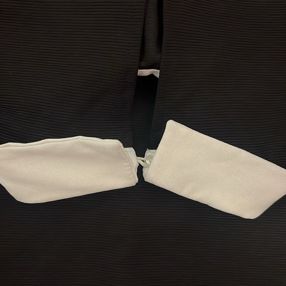 Black dress with white collar that has crystals. - Picture 5 of 6